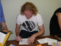 Steve signs more autographs