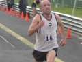 Steve Dinneen crosses the finish line to win Division 1