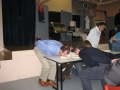 Club President, Graeme Olden and others attempting to eat a custard tart